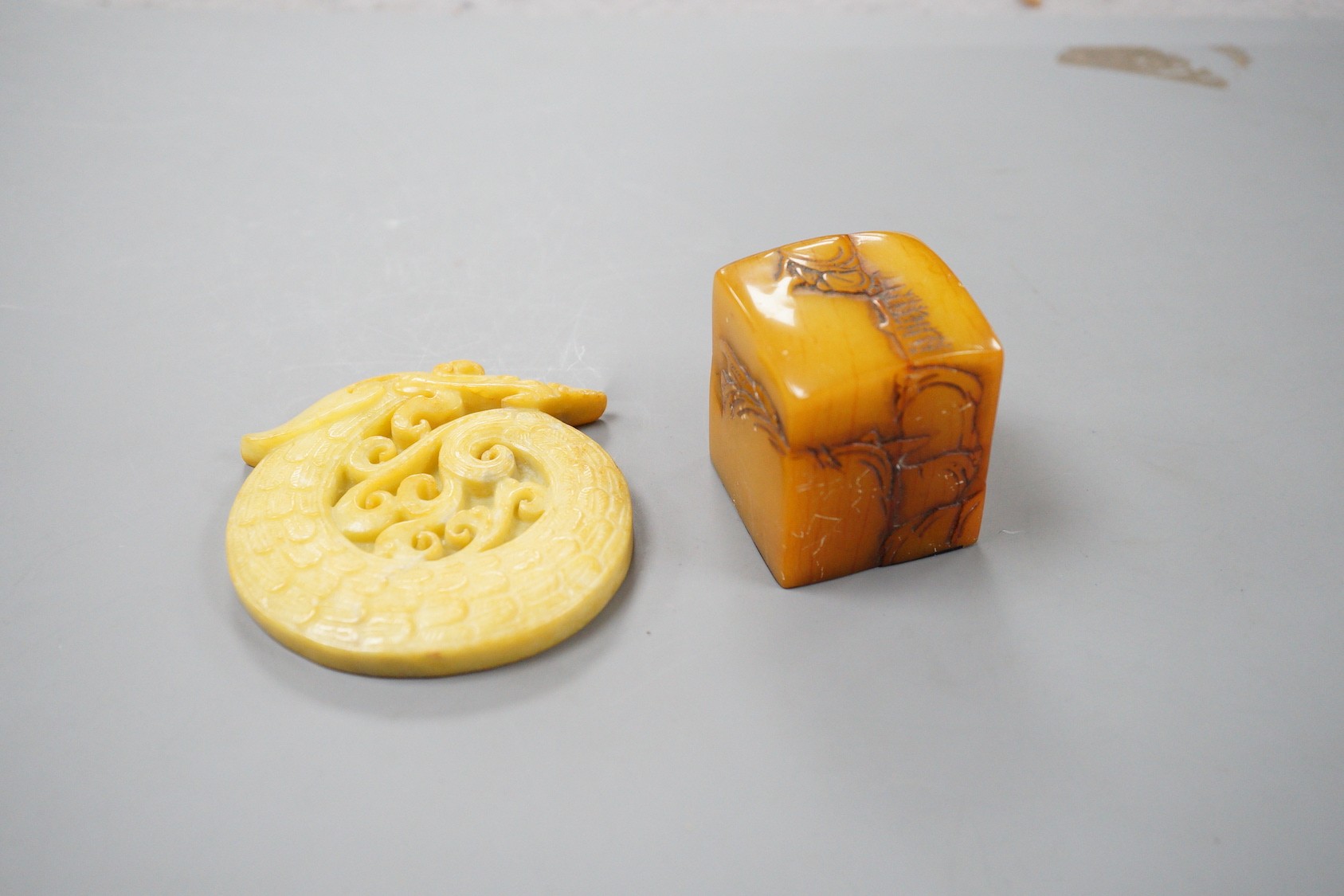 A Chinese soapstone seal, 4.5cm tall, and a hardstone plaque
